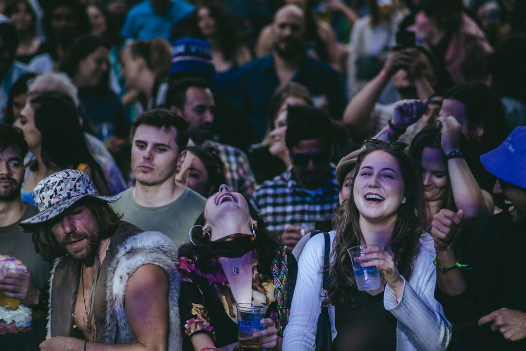 crowd laughing at screen